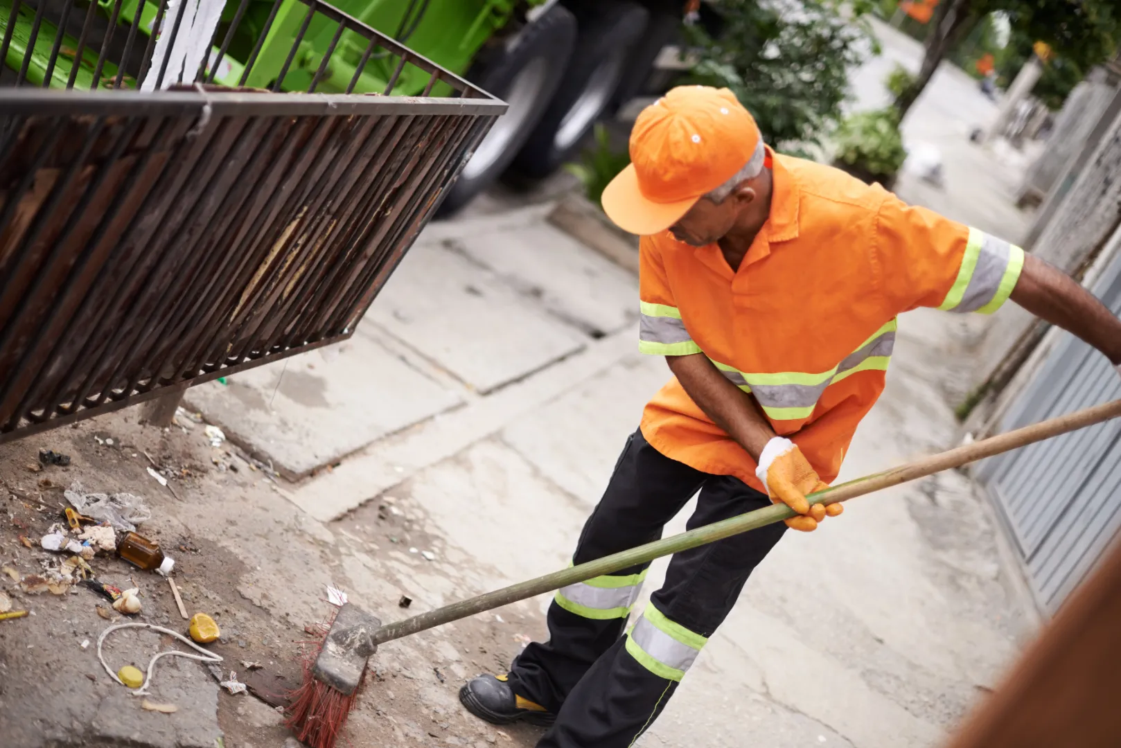 Worker removing small construction debris during cleanup